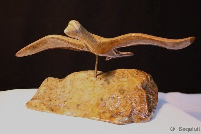Sculpture of a bird flying